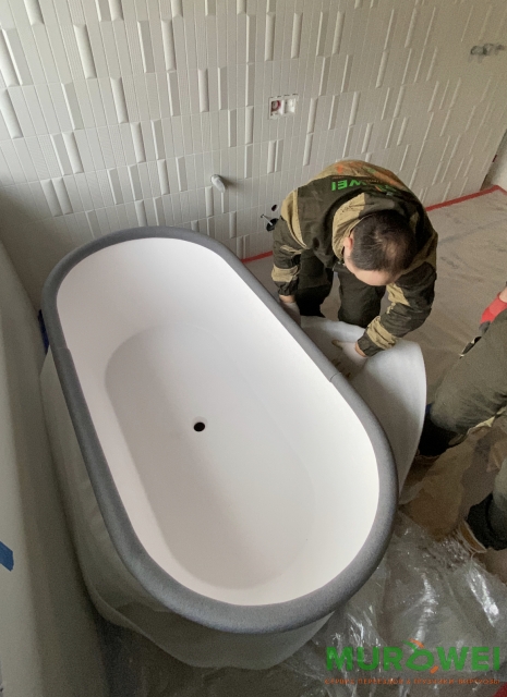 Podnoszenie kamiennej wanny